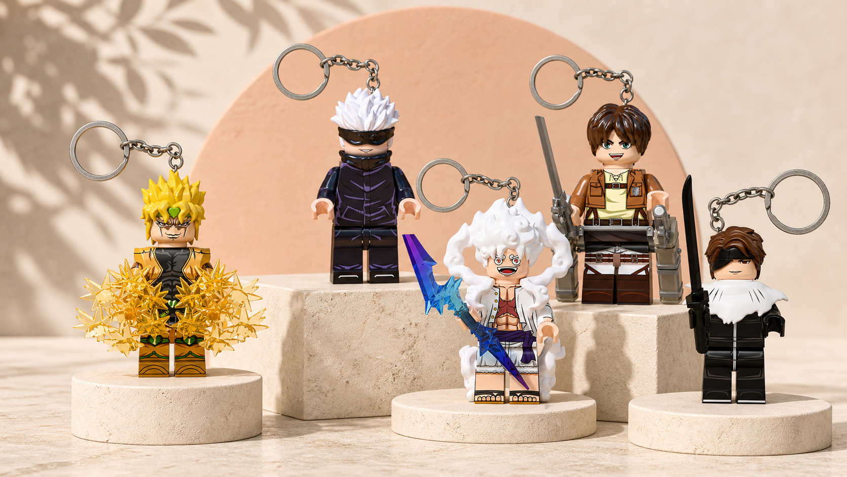 Dio, Gojo, Luffy, Eren and Aizen character keychains displayed on stone plinths